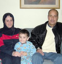 Nafie Abtan, an oncologist, and his wife, Suhair, and son, Mutaz, 2, have been living in a cottage on the grounds of the Brookfield Congregational Church since November as part of its Refugee Resettlement Ministry. Photograph by Scott Benjamin.